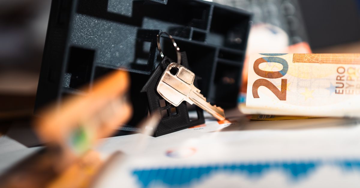 Keys with a house model, Euro bills, and charts suggesting real estate and financial themes.